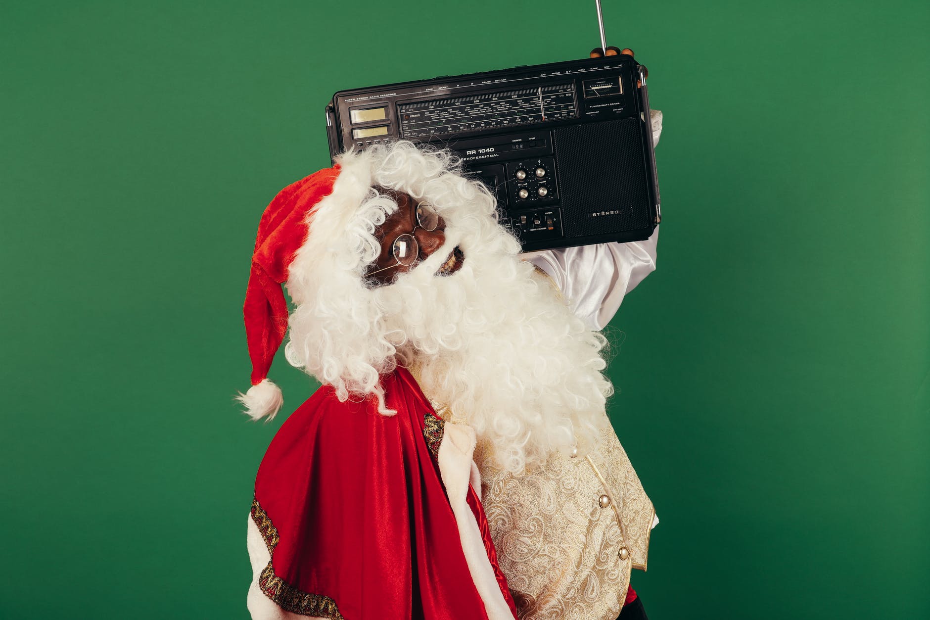 santa claus holding a classic radio