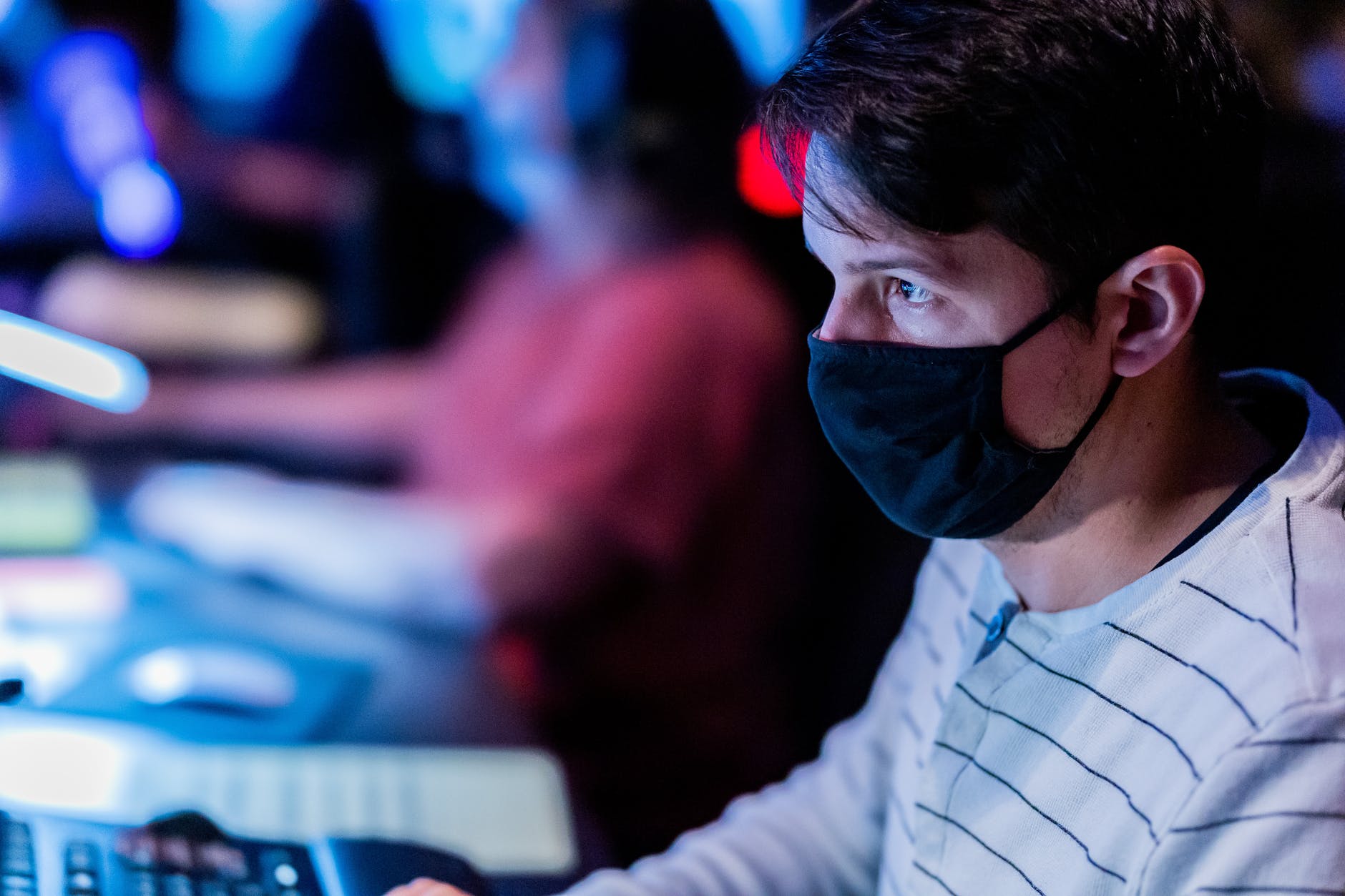 sound engineer in textile mask against mixing console
